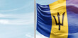 Barbados national flag with mast at light blue sky.