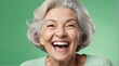 young caucasian elderly woman on plain bright green background laughing hysterically looking at camera background banner template ad marketing concept from Generative AI