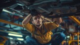 Fototapeta Tęcza - Skilled Mechanic,Car Mechanic Performing Repairs and Maintenance Underneath a Vehicle 