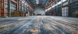Warehouse interior with worn-out flooring that requires renovation.