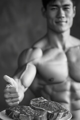 Poster - A man with a muscular body is holding a plate with two pieces of meat on it