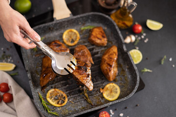 Wall Mural - marinated pieces of Organic Tuna Steak frying on a hot grill pan