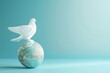 A white dove sits on top of a globe