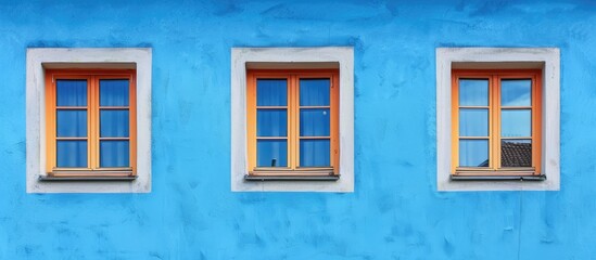 windows on a wall with blue background