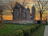 Fototapeta Kuchnia - Historic buildings of the church and village in Tum, Poland.