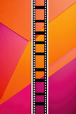 Fototapeta Sport - colorful abstract background with film strip.orange magenta background with film strip for background
