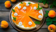  cheesecake with apricot jelly and fresh apricot on a wooden table