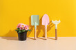 © Cavan Images - Gardening tools with Pink primrose in pot. Backdrop for garden shop.