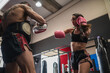© Cavan Images - Female fighter sparring with personal coach during training session