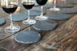 round slate coasters with wine glasses during a tasting event