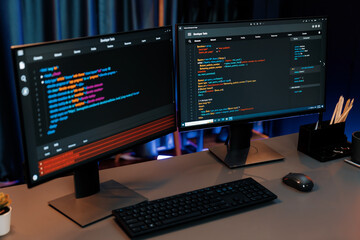 programming code on computer two screens on desktop placing working desk showing intelligent website