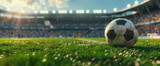 Fototapeta Fototapety sport - Soccer ball on the field of stadium with blurred fans in background