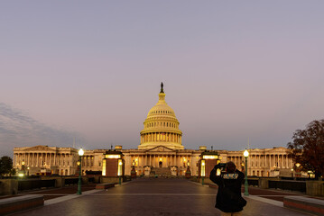 Wall Mural - A tourist capturing the Capitol Building in Washington, D.C., at sunrise