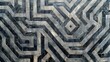 Black and white marble floor with intricate geometric pattern of triangular cement tiles forming a labyrinth, background, wallpaper