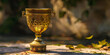 Christian chalice golden wine symbolizing sacrament and spirituality, The golden monstrance with a little transparent crystal center consecrated host church defocused background.

