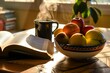 © primopiano - open book on table, steamy tea mug, morning light on fruit bowl