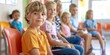 © kimly - A group of children sitting in the waiting room of a pediatric clinic.