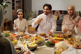 Fototapeta  - Muslim Family Enjoying Dinner In Majilis