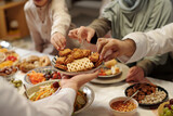 Fototapeta Tulipany - Unrecognizable Muslim Man Offering Cookies During Dinner