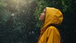 A woman wearing a yellow raincoat stands outdoors in the park, gazing up at the sky. Generative ai