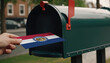 Close-up of person putting on letters with flag Missouri in mailbox