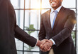 Businessman shaking hands with colleagues. Handshake at meeting