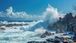 © Artyom - Powerful waves crashing against jagged rocks under a blue sky with fluffy clouds.