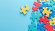 Assorted colorful puzzle pieces scattered on a blue background.