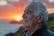Elderly man gazing at the sunset, closeup on his peaceful smile, reflecting a life well-lived and healthy aging