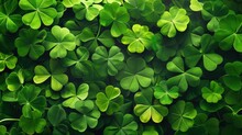 Green Seamless Background With Clover Four-leaf Blurred Leaves. Fresh Clover Leaves On Green Background. Copy Space