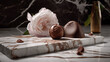 Chocolates and delicate pink and white flowers on an elegant marble background