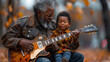 Senior man teaching young child to play guitar outdoors with autumn leaves in the background.