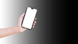 Close-up of hand holding smartphone with blank on screen isolated on background of black and white.