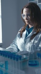 Poster - A microbiologist, a computer microbiologist, explores the mechanisms of interaction between viruses and cells in the laboratory, helping to understand the principles of infectious diseases. His work