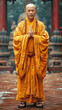 A monk standing gracefully in a famous temple, he exudes a kind aura. He is embellished with an orange Hanfu, exuding a kind aura.