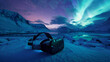 A VR headset in a snowy landscape at twilight, with the aurora borealis shimmering in the sky above