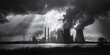 A black and white photo of a power plant with smoke billowing out of it