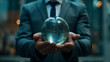 © Ali - glass globe in hands of a businessman