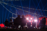 Fototapeta Uliczki - Night outdoor concert, spotlight rays