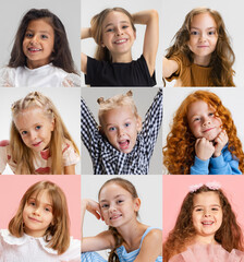 Mosaic of emotions. Portraits of cute little girls, children of different races posing against pastel color studio background. Concept of human emotions, childhood, fashion, style, beauty, education.
