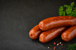 Sausages on a black background.