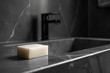 Bar of soap on a marble countertop with a modern faucet in the background