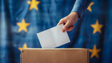 Fototapeta Perspektywa 3d - A hand placing a ballot into a box with the European Union flag in the background, symbolizing democratic voting in EU elections