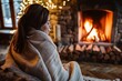 wrapped in blanket, woman near fireplace