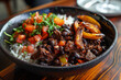 Pabellon Criollo dish featuring rice, black beans, tender beef, and sweet fried plantains. Venezuelan dish.