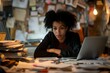 © Iuliia - Frustrated tired black woman sitting at his working place in office with laptop and unorganized paperwork. Overwork in business, stress from messy