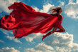 © redgun - Woman superhero with large red cape