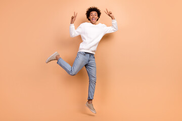 Canvas Print - Full length photo of positive crazy cheerful guy have fun good mood nice party v-sign isolated on beige color background