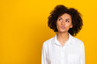 © deagreez - Portrait of attractive suspicious funny wavy-haired girl thinking copy space isolated over bright yellow color background