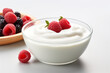 Plain yogurt or Greek yogurt in a bowl served with fresh berries
